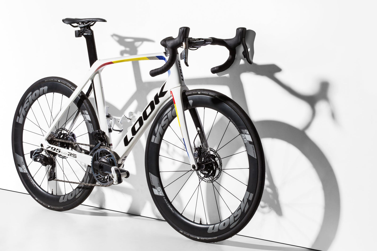 Aero road bike with a sleek white frame featuring the brand name 'LOOK' and black wheels.